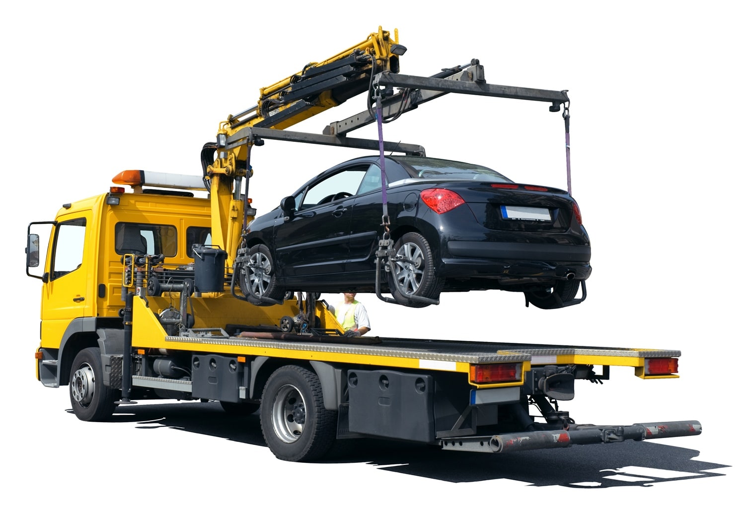 Carro attrezzi con una vettura caricata sul pianale.